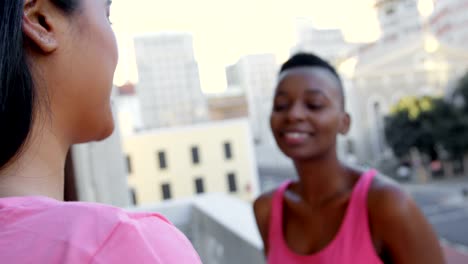 Women-hugging-each-other-in-balcony-at-home-4k