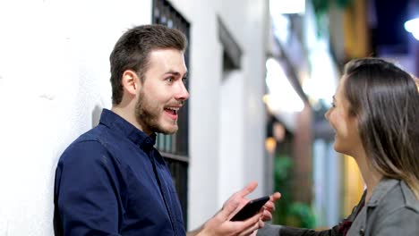 Couple-or-friends-meeting-in-the-night-in-the-street