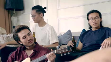 group-of-young-asian-musician-gathering-drinking-beer-at-home