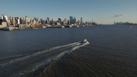 Following-Boat-on-Hudson-River-With-Upper-West-Side-In-View