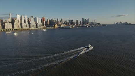 Following-Boat-on-Hudson-River-Viewing-Uptown-Manhattan