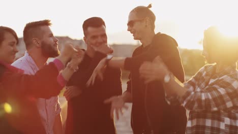 Group-of-Teenagers-Hanging-out,-Listening-to-Music-and-Dancing-Outdoors.