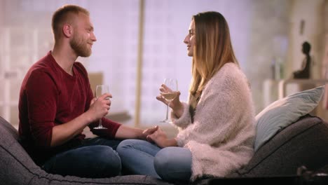 Romantic-couple-on-couch-flirting