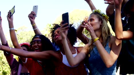 Female-friends-having-fun-at-music-festival-4k