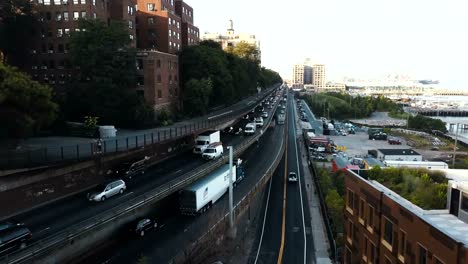 Aerial-view-of-the-road-junction-in-Brooklyn,-New-York,-America.-Drone-flying-over-the-traffic-road-in-downtown