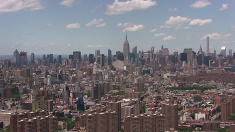 Aerial-shot-of-downtown-Manhattan-buildings-from-East-River.