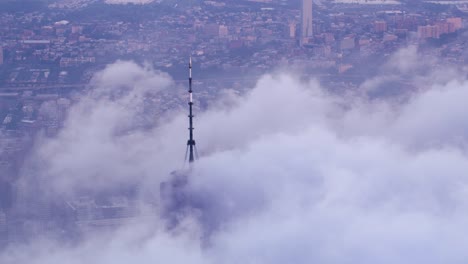 Aerial-view-of-One-World-Trade-Center-building-with-low-clouds-at-sunrise.