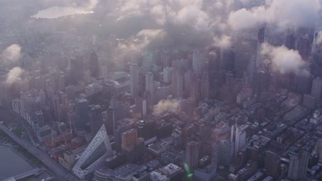 Aerial-view-of-Manhattan-with-low-clouds-at-sunrise.