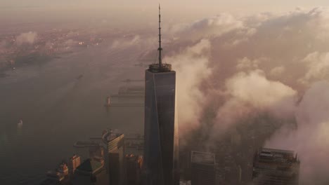 Sunrise-over-Manhattan-with-clouds-passing-One-World-Trade-Center-building.