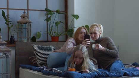 Two-female-friends-watching-media-content-on-phone