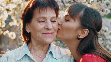 Daughter-kissing-her-elderly-mother