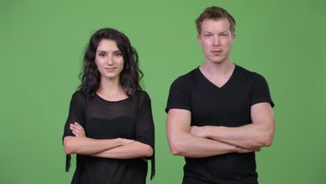 Young-couple-with-arms-crossed-together