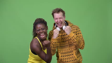 Young-multi-ethnic-couple-giving-high-five-together