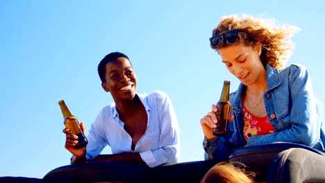 Female-friends-having-beer-in-the-car-4k