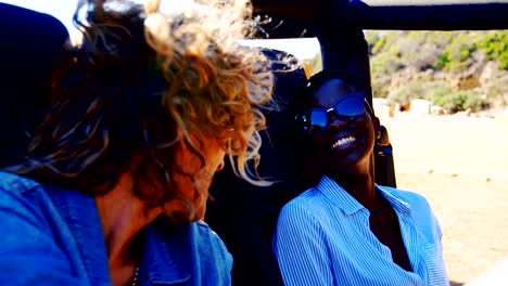 Group-of-female-friends-interacting-each-other-in-the-car-4k