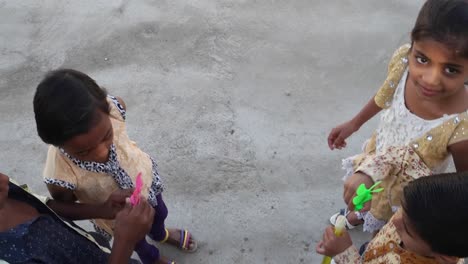 Indian-children-blowing-bubbles-and-playing-with-friends