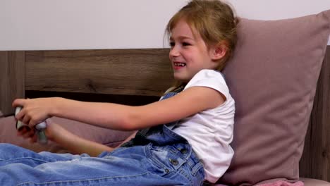 Cheerful-girl-plays-computer-game