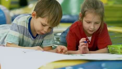 Two-Little-Friends-Drawing-with-Crayons