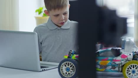 Boy-and-Girl-Discussing-Car-Model