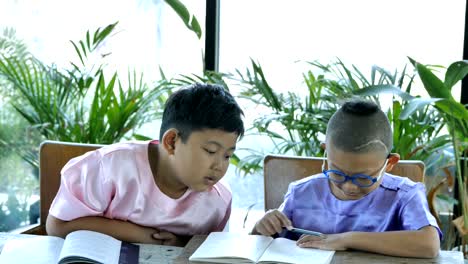 Asian-boy-two-people-Read-books.-education-concept