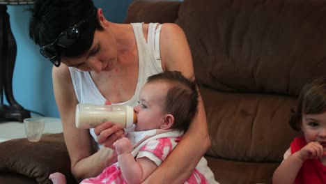 Mother-Feeding-Her-Baby-Girl