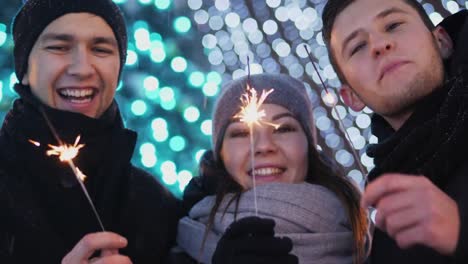 Three-close-friends-celebrating-New-Year-outdoors