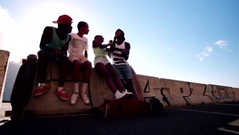 Mixed-racial-group-of-cool-teen-skater-friends