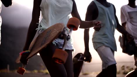 Teen-longboarders-looking-cool-walking-together