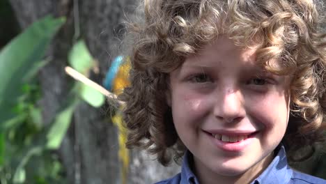 Boy-Smiling-with-Parrot