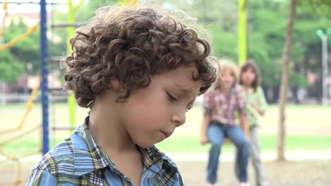 Sad-Young-Boy-at-Playground