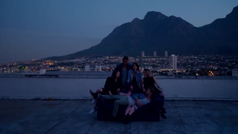 Young-friends-hanging-out-on-the-rooftop-for-a-party