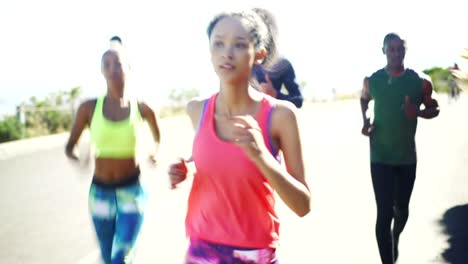 Group-of-athletes-jogging-outdoors