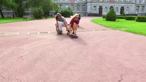 Happy-skateboarders-having-fun-riding-in-crouched-position