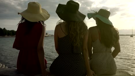 Girlfriends-enjoying-sunrise-at-beach