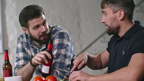 Man-Chatting-and-Cutting-Cucumbers