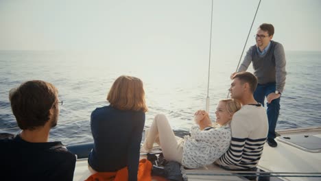 Group-of-people-relaxing-on-a-yacht-in-the-sea.