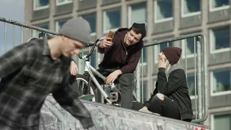 Good-looking-skatergirl-and-handsome-bmx-boy-making-a-selfie