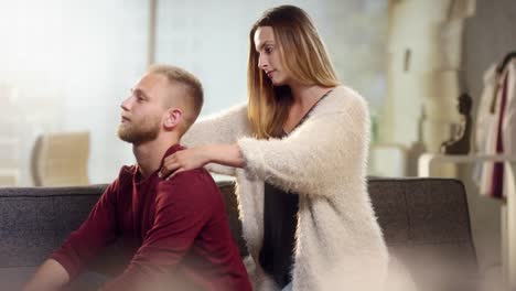Young-woman-gives-his-boyfriend-a-beautiful-neck-massage