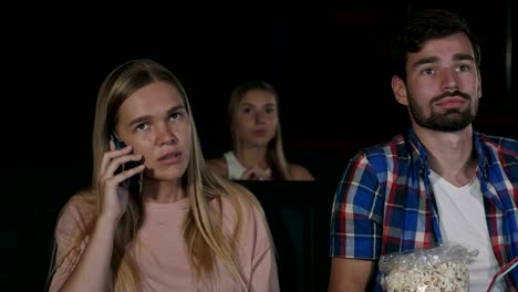 Annoying-woman-on-the-phone-during-movie-at-the-cinema