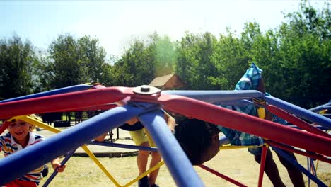 Schoolkids-playing-on-dome-climber-in-playground