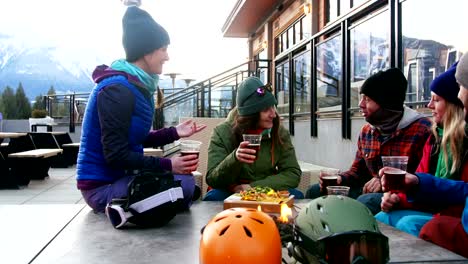 Friends-interacting-while-toasting-a-glass-of-drink