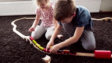 Children-build-wood-model-toy-locomotive
