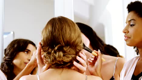 Happy-bridesmaids-are-getting-bride-ready-for-wedding-4K-4k