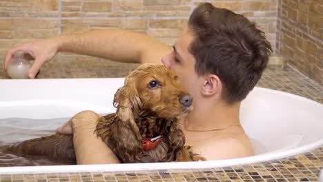 Man-and-dog-washes-in-a-hot-bath