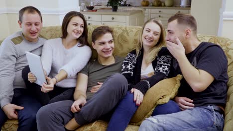 Five-young-friends-makes-selfie-at-digital-tablet-at-home