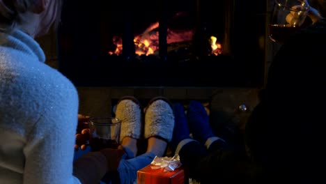 Romantic-couple-relaxing-in-front-of-a-fire