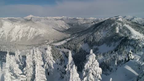 Snowy-Aerial-Reveal-of-Winter-Mountain-Sports-Ski-and-Snowboard-Resort