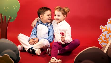 Boy-and-a-girl-with-large-Lollipop.