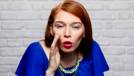 Facial-Expressions-Of-Young-Redhead-Woman-On-Brick-Wall