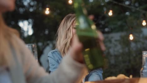 Friends-enjoying-drinks-at-alfresco-garden-dinner-party